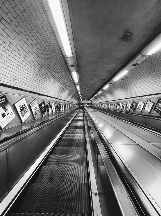 a black and white po of an escalator