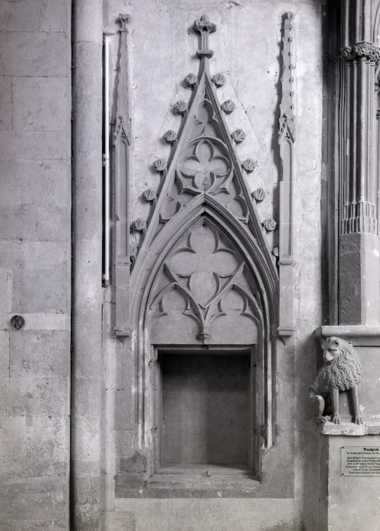 a stone fireplace inside a cathedral next to a statue