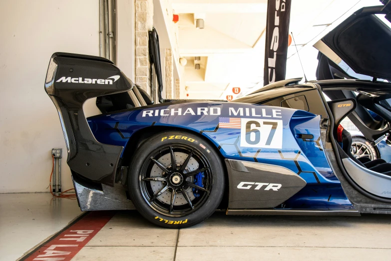 a car is shown parked by a garage