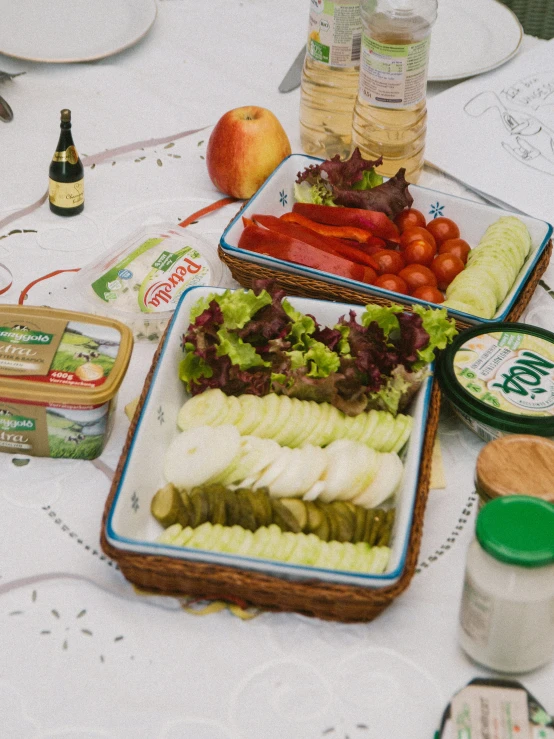 a table with several trays of fresh food including fruits and vegetables