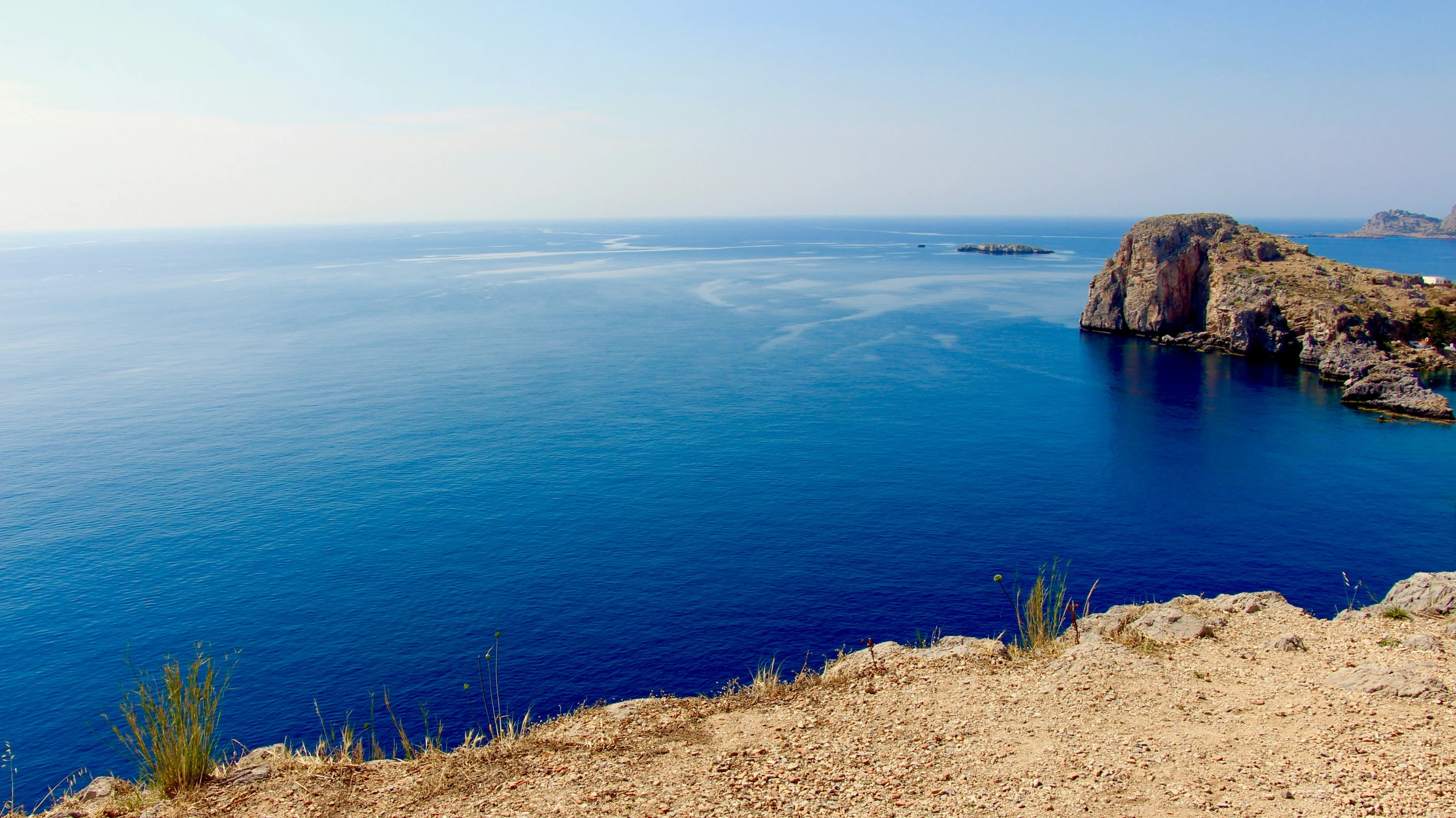 an empty lake is shown on the edge of a cliff