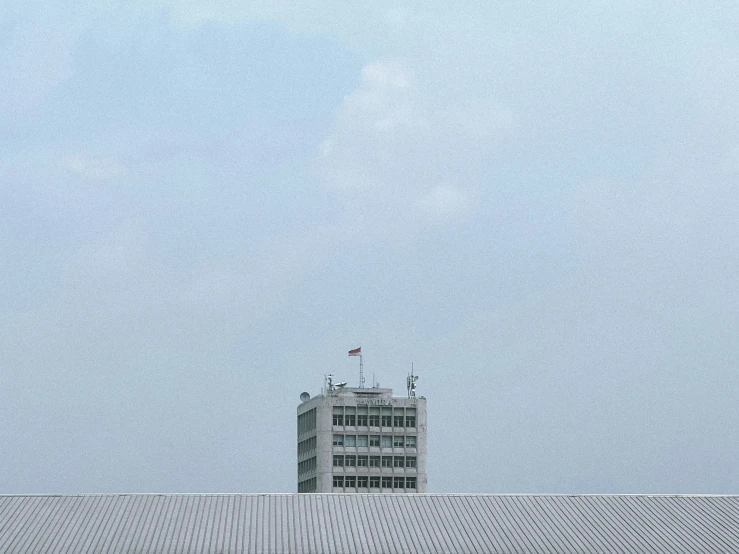 some tall buildings are seen against the blue sky