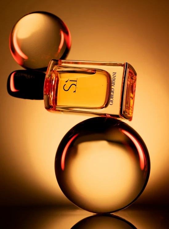 a bottle of perfume with a ring