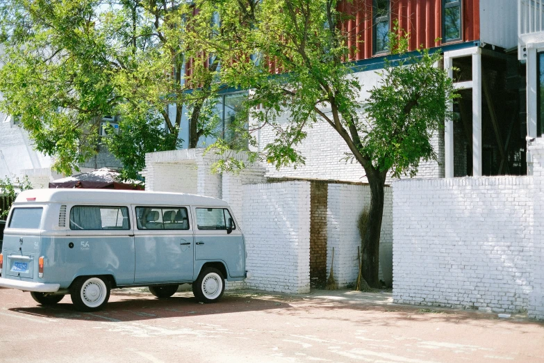 a blue and white van parked on the side of the road