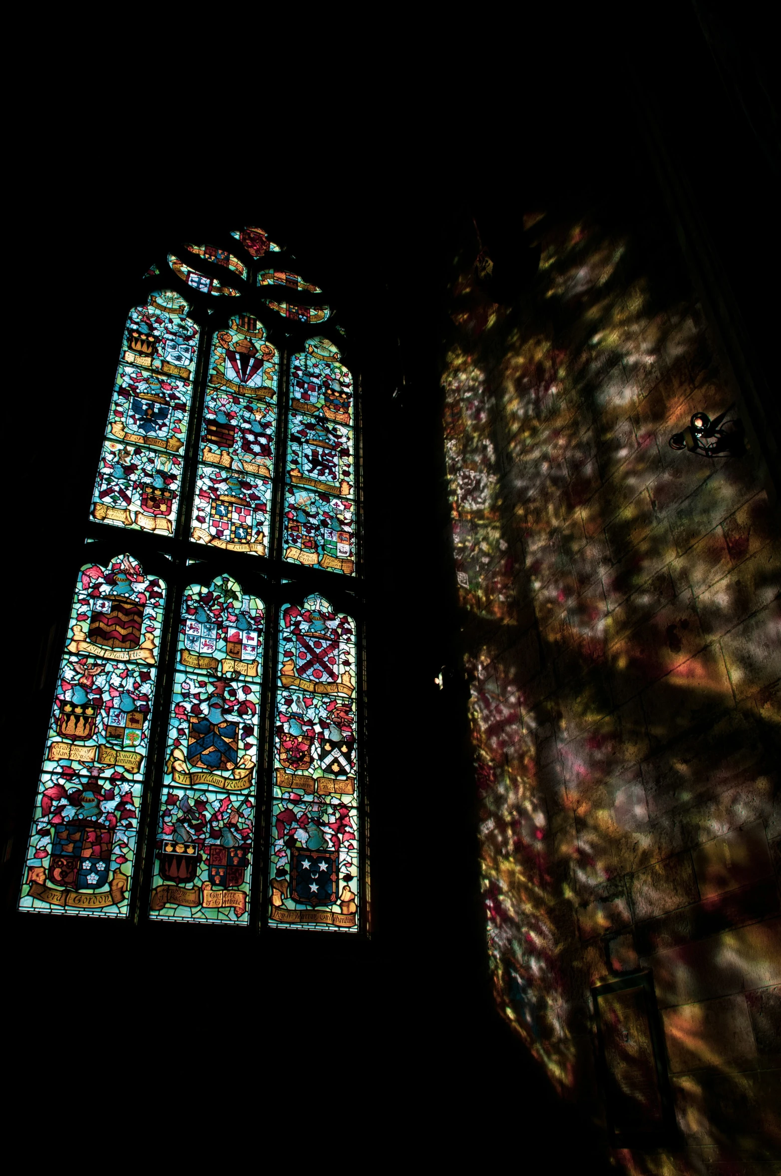a stained glass window that appears to be lit up