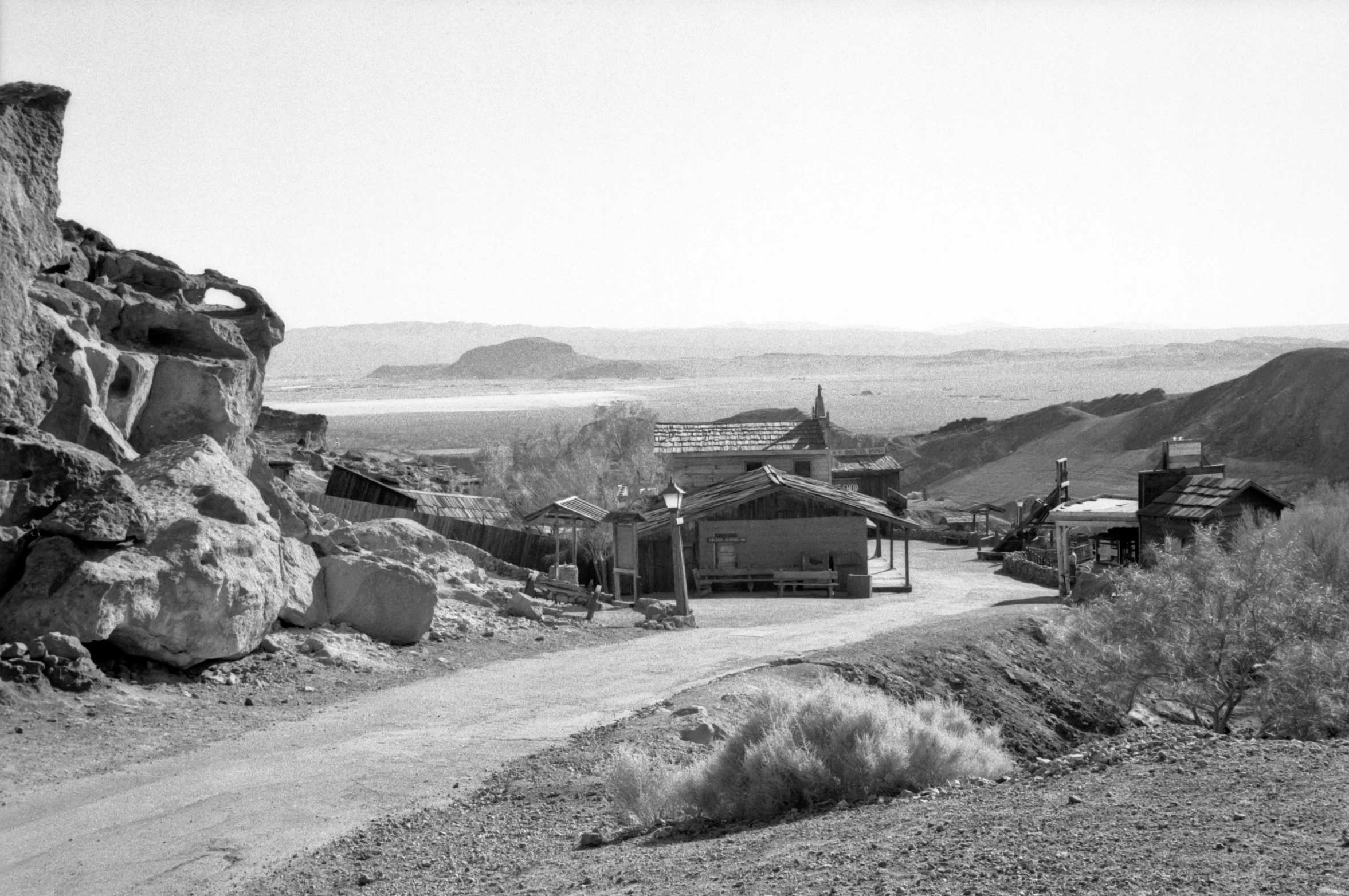 an old po of a road and a building in the distance