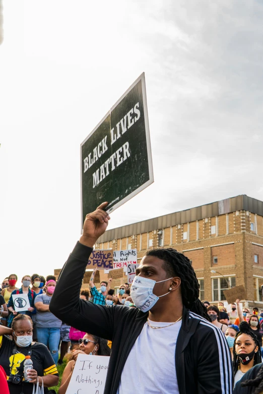 some people are holding signs in the air