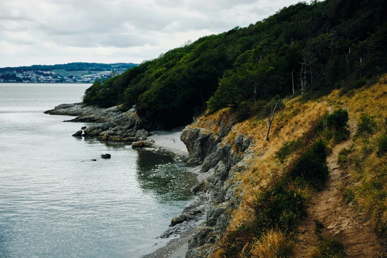 a body of water with a mountain in the distance