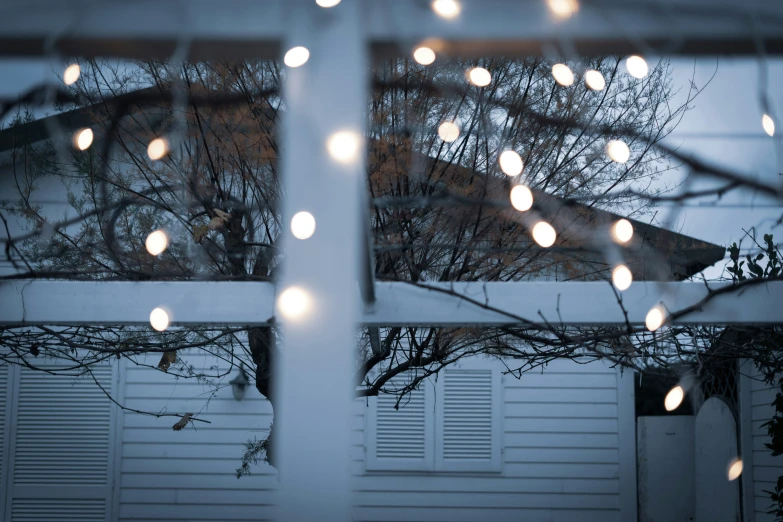 view out of window on houses with lights from the outside