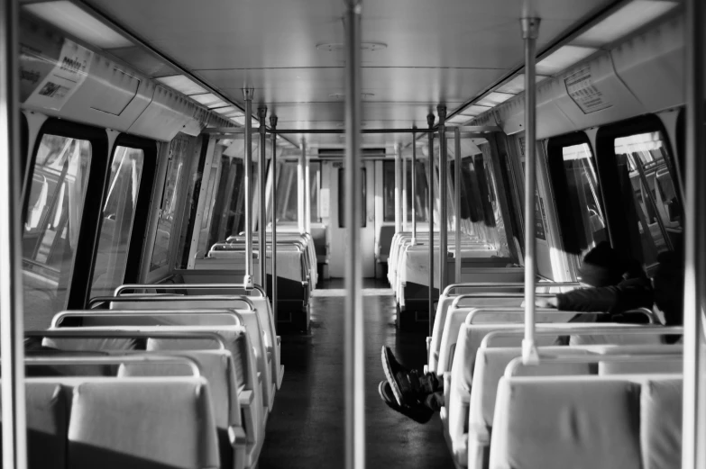 an empty subway train car is pictured in black and white