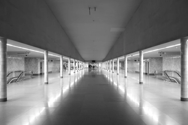 an empty parking garage with lights on