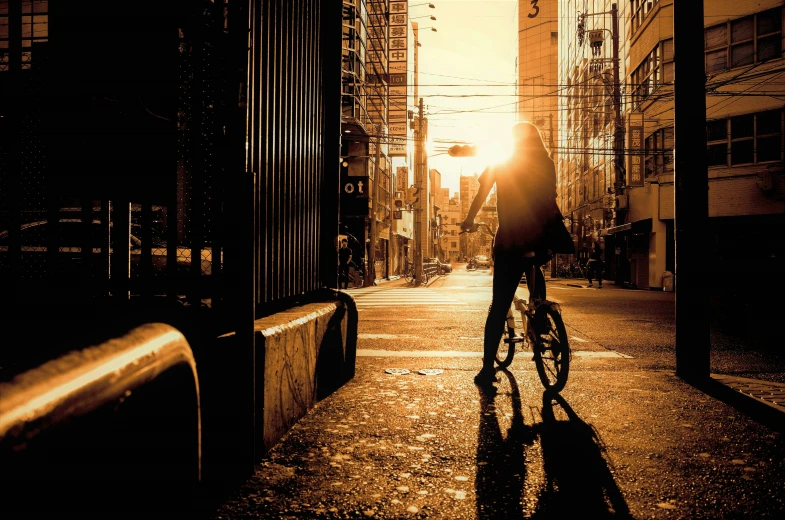 a person riding their bicycle down an urban street