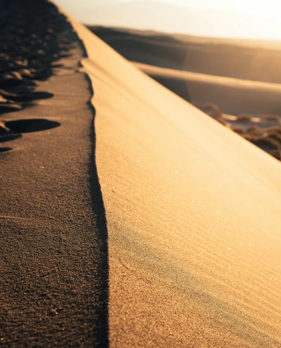 a line of rocks and sand on a hill side