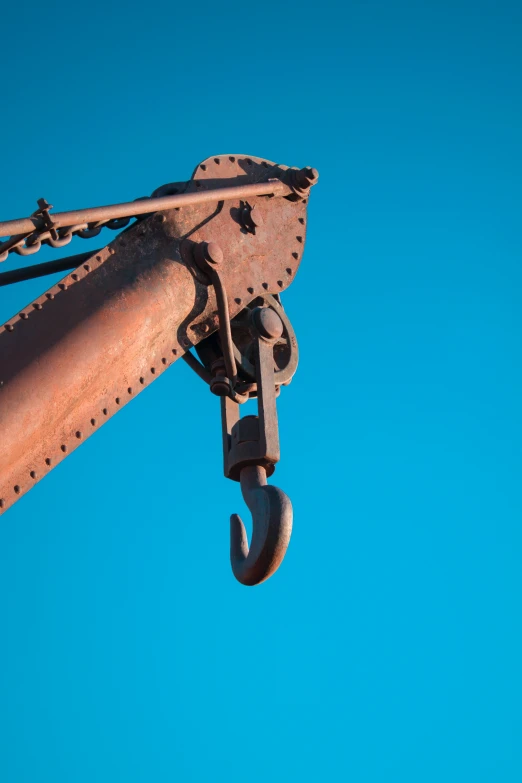 metal hook and chain attached to steel object