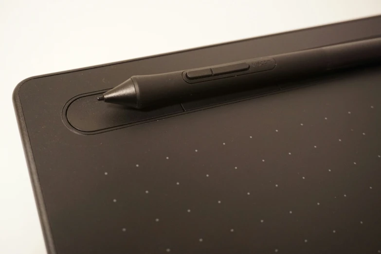 a digital tablet with a pen on the cover