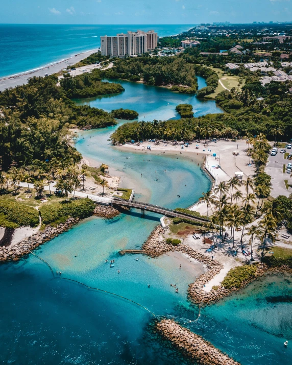 a bird's eye view of a beach resort in front of an ocean