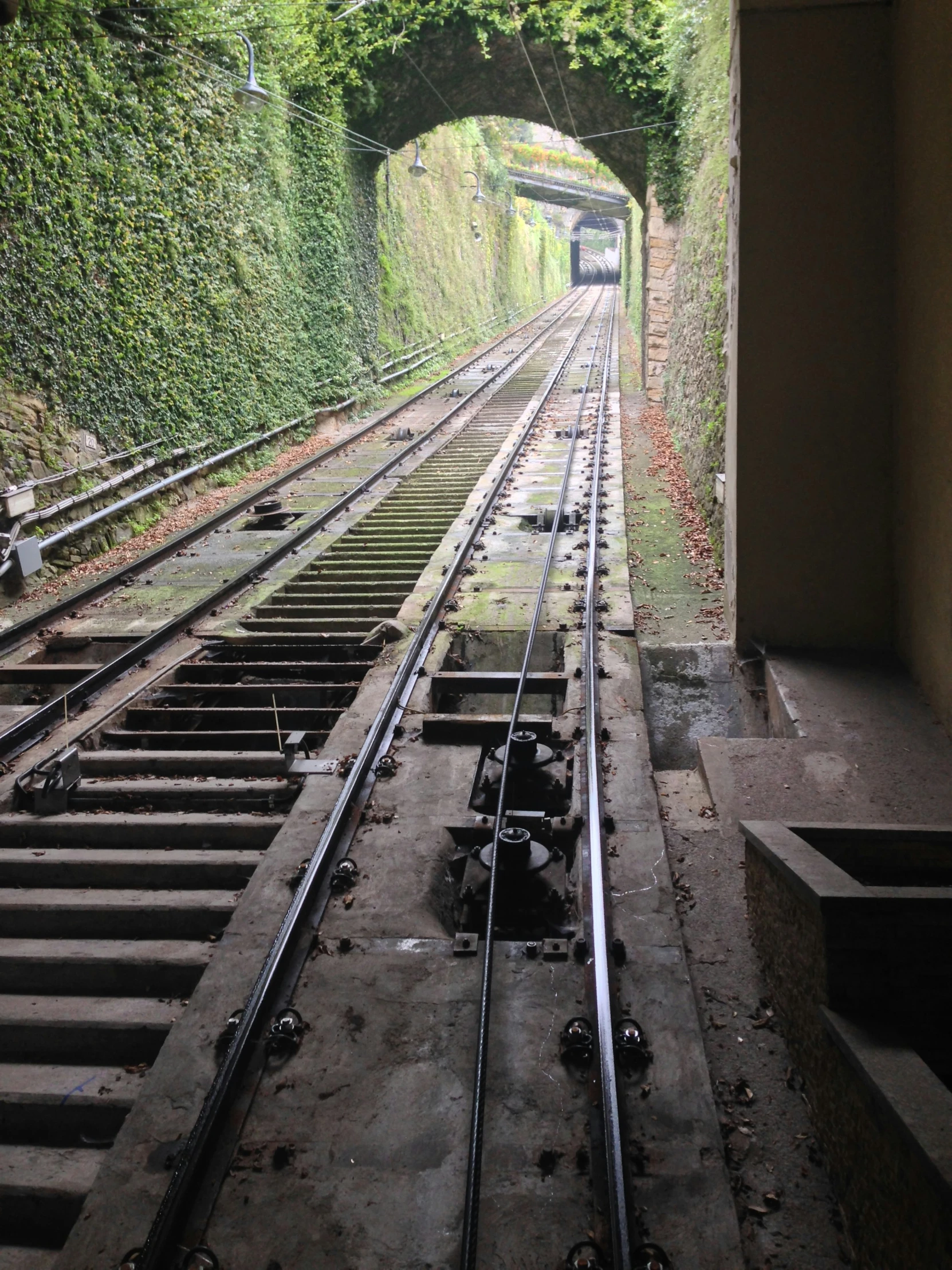 an empty railway train track with many sets of rails