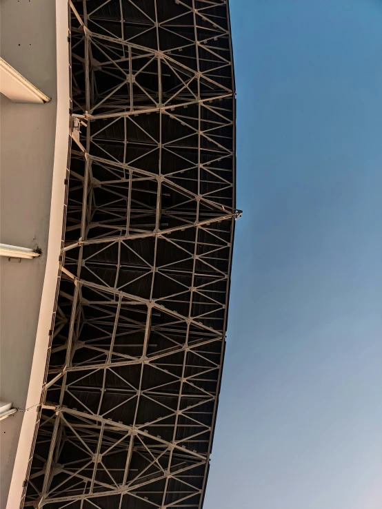 the view from the underside of an airplane looking up at the structure