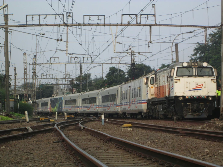 a train going down the tracks in the middle of nowhere