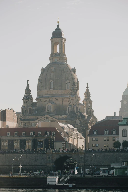 large cathedral on top of a castle above a river