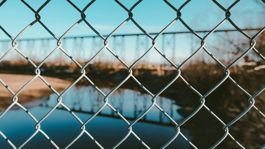 a fence with the view of the water behind it