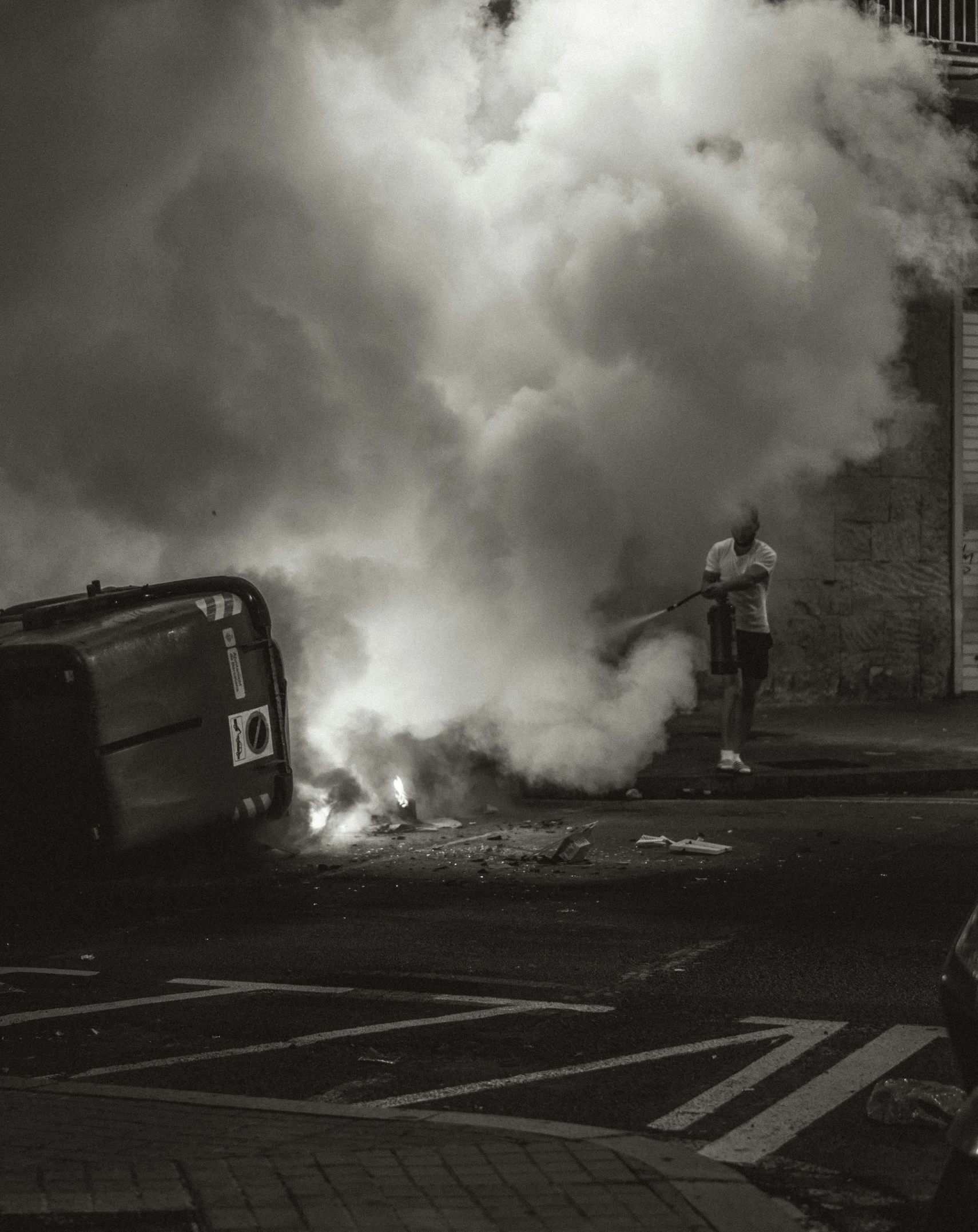 a car parked in front of a bunch of smoke