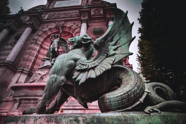 a statue is shown sitting in front of a building