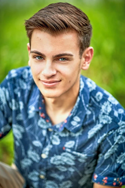 a man that is looking forward and wearing a shirt