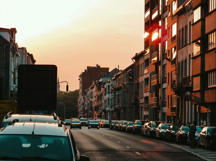 cars are lined up on a city street