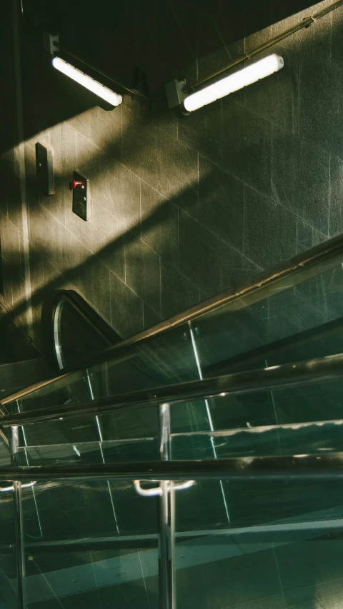 a metal staircase leading down the hall to the sky