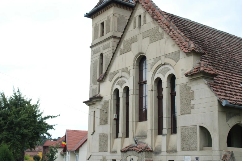 an old church with ornate architectural details on a cloudy day