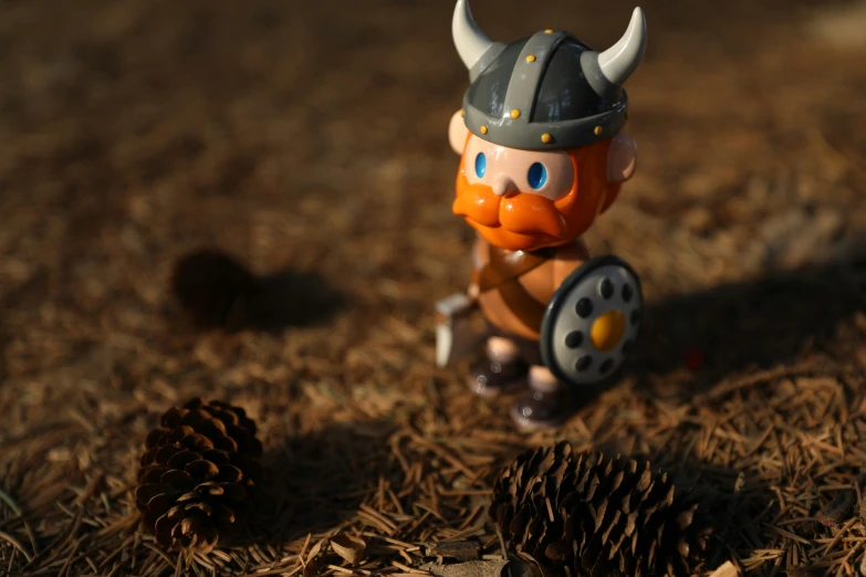 a little figure with horns and orange beard is walking in the ground