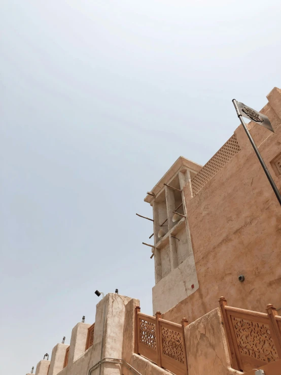 the corner of a building with a tall tower next to it