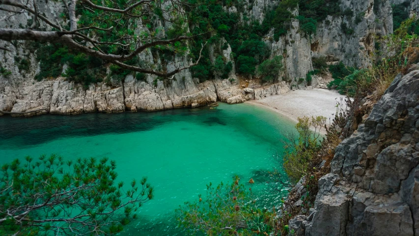 an image of a lake surrounded by rocks