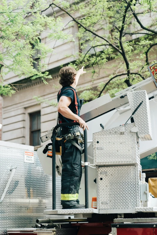 a fireman standing near a fire truck