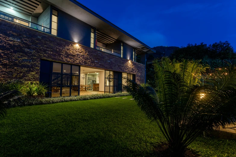 a house at night with the lights on