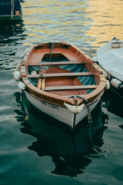 several empty boats in the water next to each other