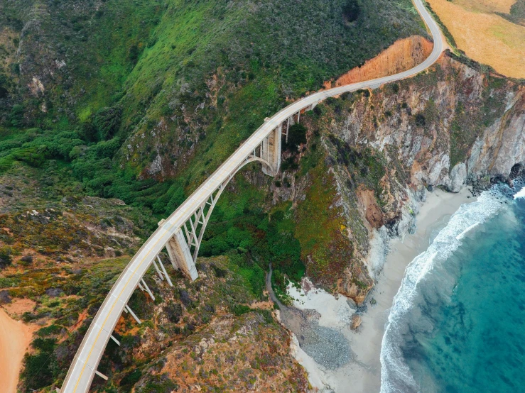 a view of a road going along the side of a cliff