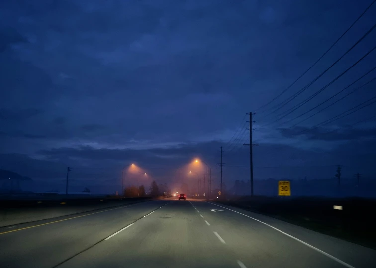a night time po of an empty highway