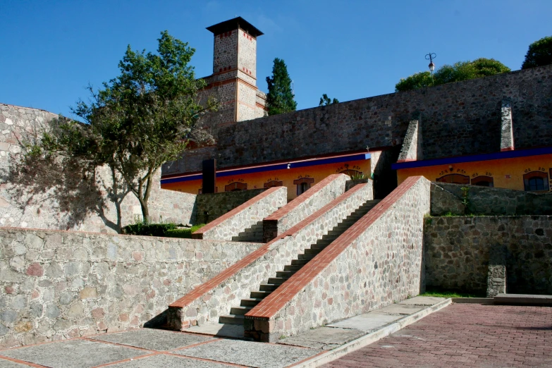 stone staircase leading up to a brick building