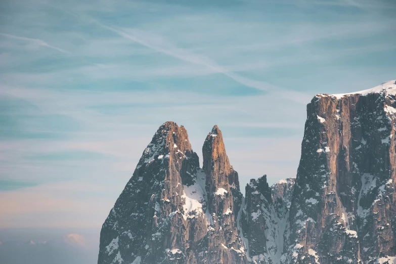 the mountains are covered in snow on the day