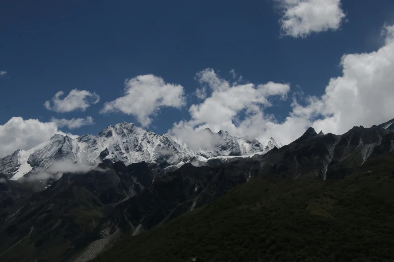 mountains with clouds and the tops obscured in front of them