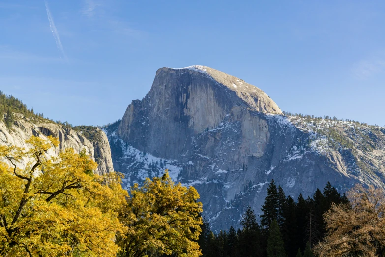 a mountain that has a big rock face