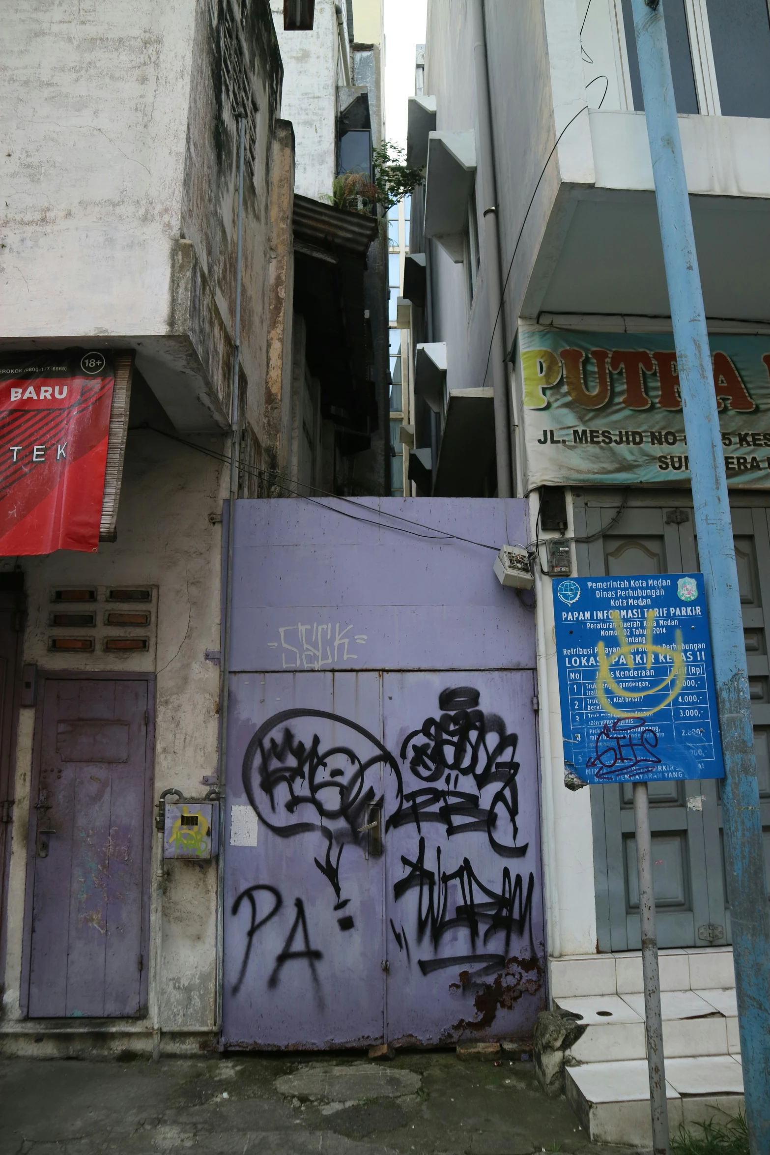 the entrance to the building with graffiti on it