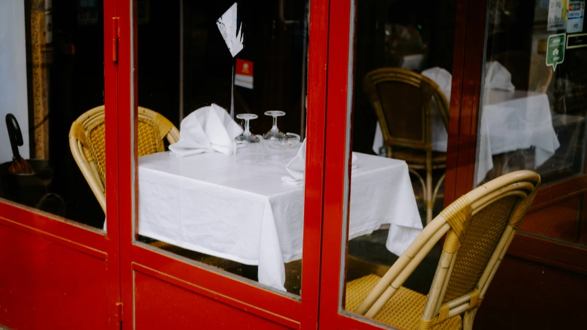 the tables are outside next to each other in a restaurant