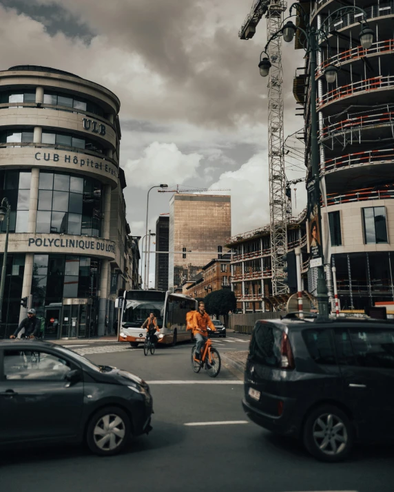 a man riding a bike down a busy street