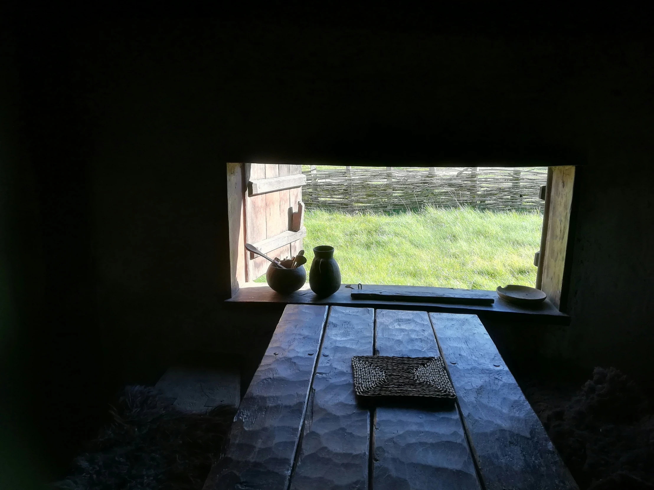 a picture taken of a table inside a room with a window