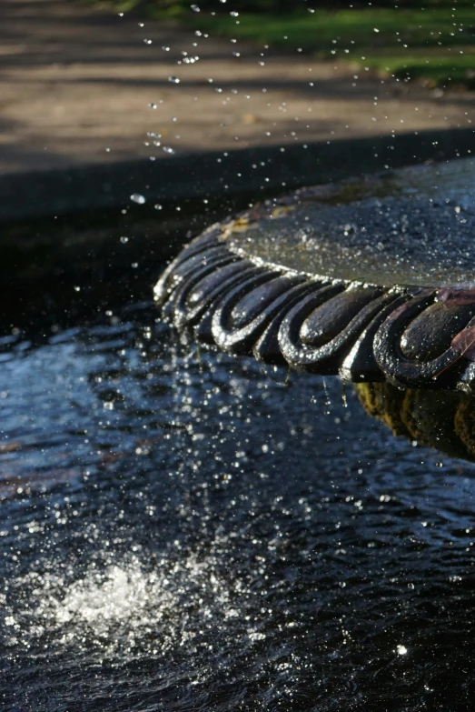 water running over a bench, making bubbles