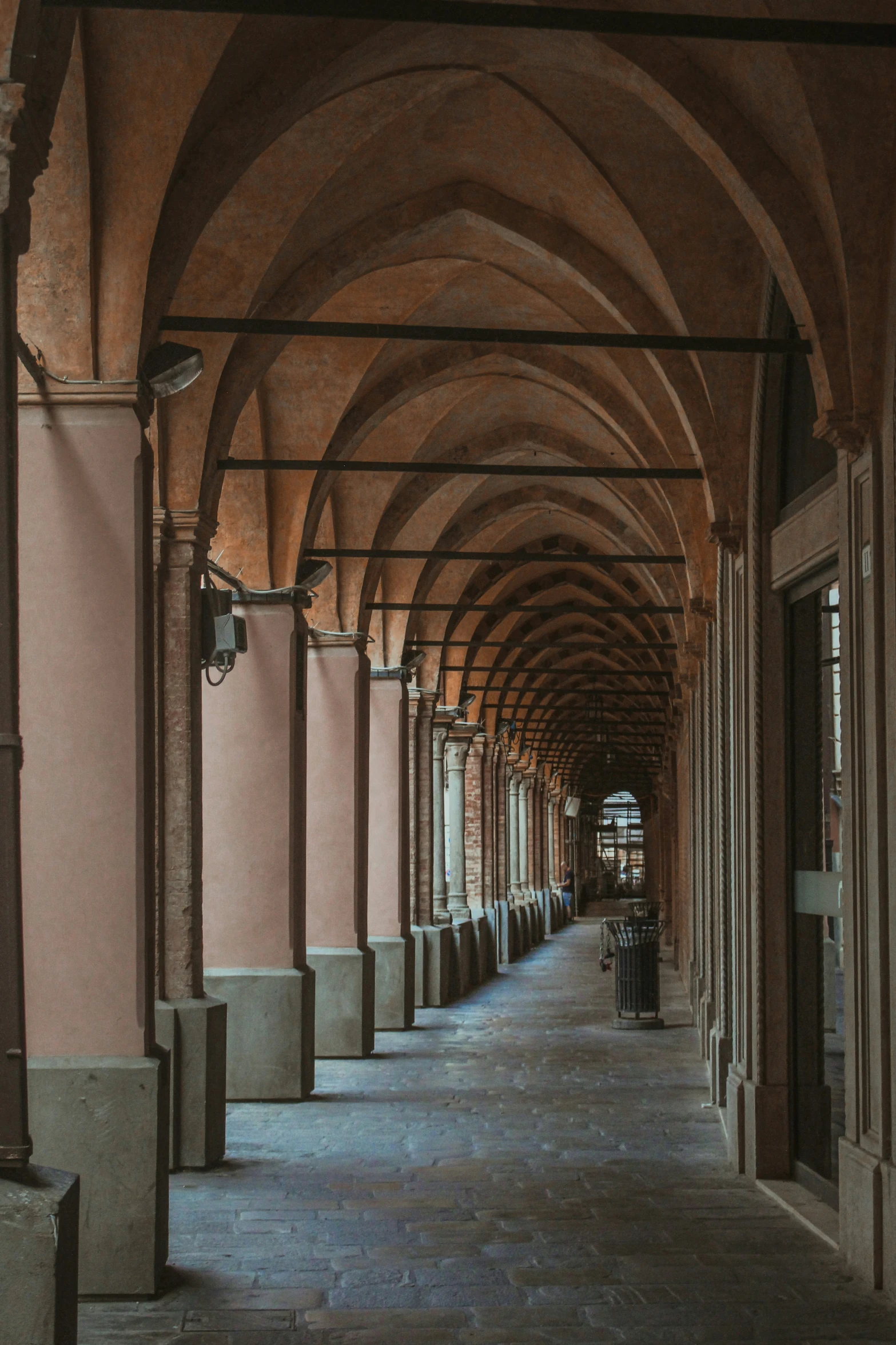 an intricate covered hallway has columns and arches