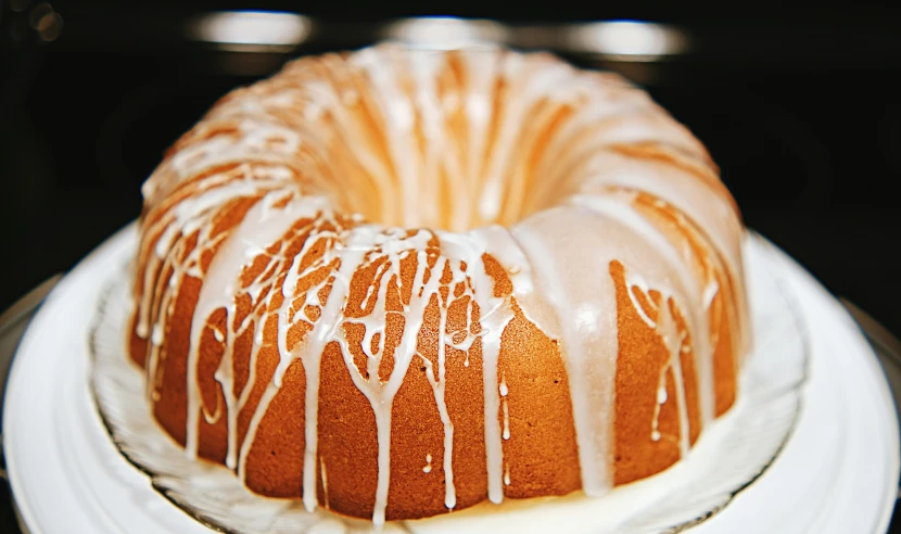 an elegant bundt cake with a lemon drizzle